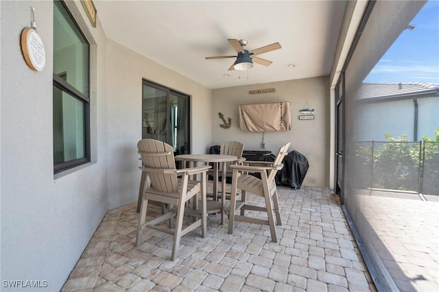 view of patio featuring ceiling fan