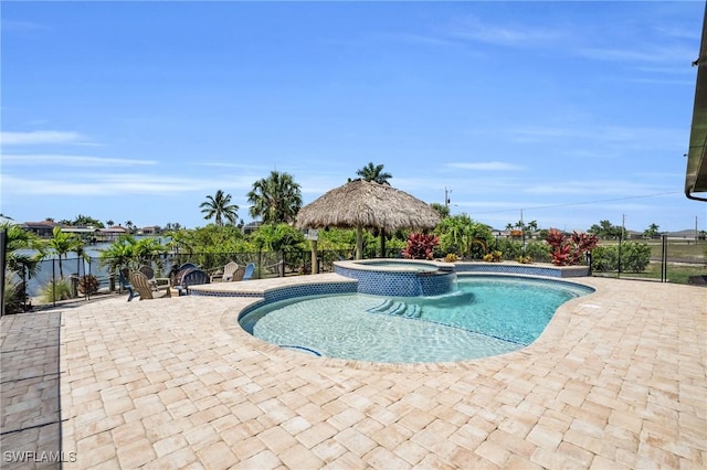 view of pool featuring a patio, an in ground hot tub, and a gazebo