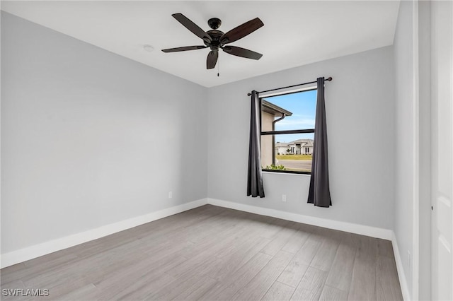 spare room with ceiling fan and light hardwood / wood-style flooring