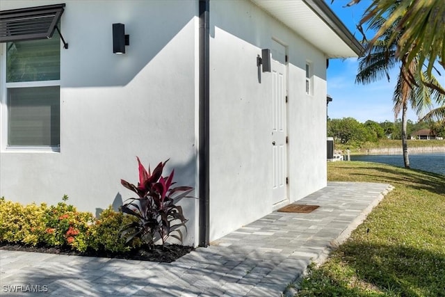 view of property exterior with a lawn