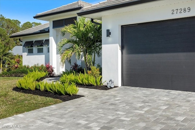 doorway to property featuring a garage