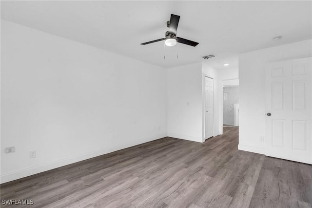 unfurnished room featuring hardwood / wood-style floors and ceiling fan