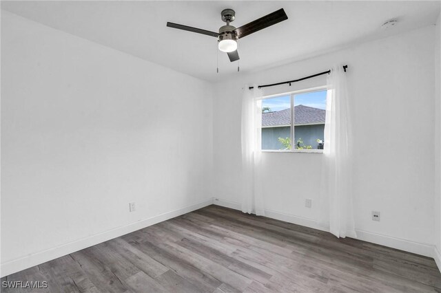 spare room featuring ceiling fan and wood-type flooring