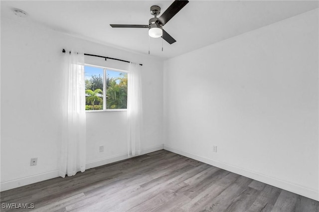 empty room featuring ceiling fan and wood-type flooring