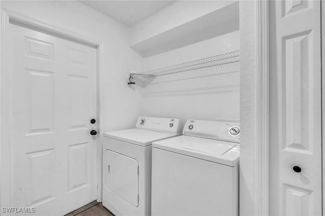 laundry room with separate washer and dryer