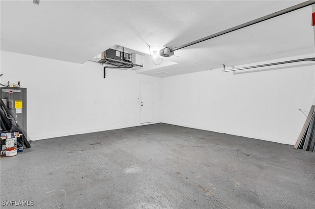 garage featuring a garage door opener and electric water heater