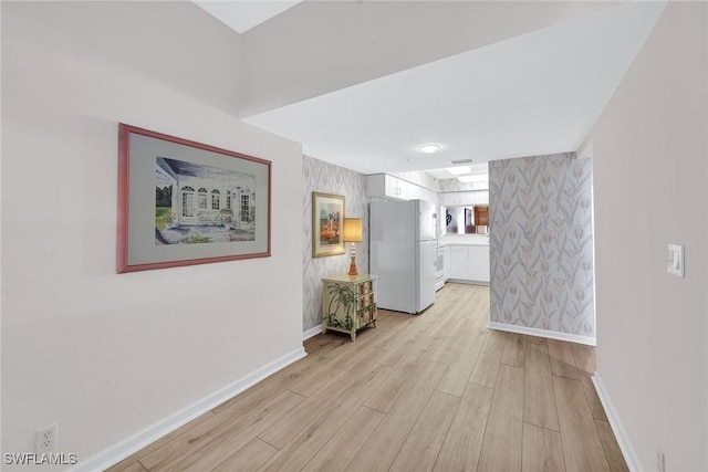 990 Cape Marco Dr Unit 1102, Marco Island, FL 34145 - hall featuring baseboards, light wood-style flooring, and wallpapered walls