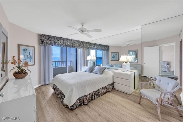 bedroom with light hardwood / wood-style floors and ceiling fan