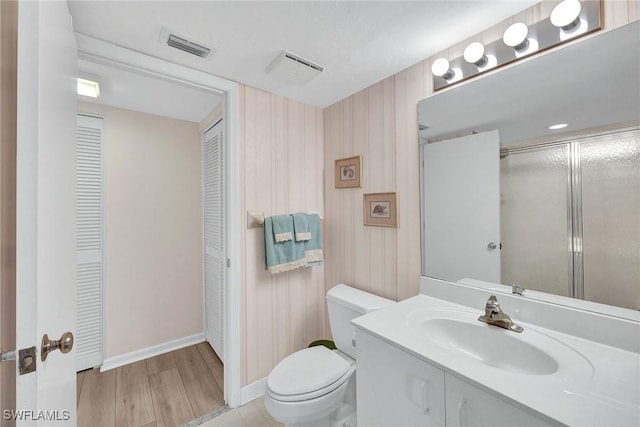 990 Cape Marco Dr Unit 1102, Marco Island, FL 34145 - bathroom featuring a closet, toilet, vanity, baseboards, and wood finished floors