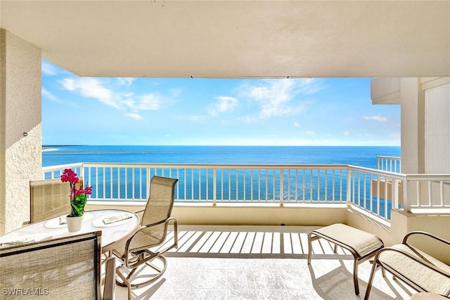 balcony featuring a water view