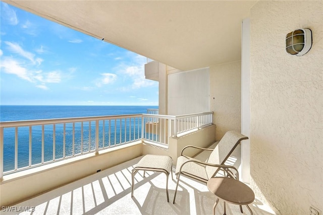 balcony featuring a water view