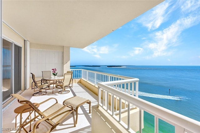 balcony featuring a water view