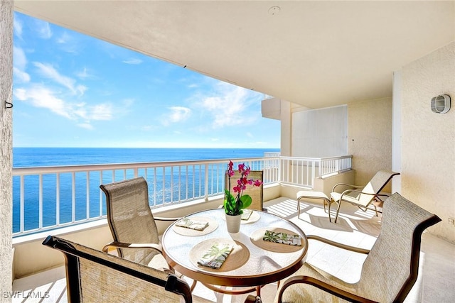 balcony featuring a water view