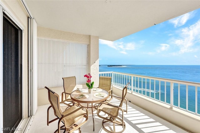 balcony featuring a water view