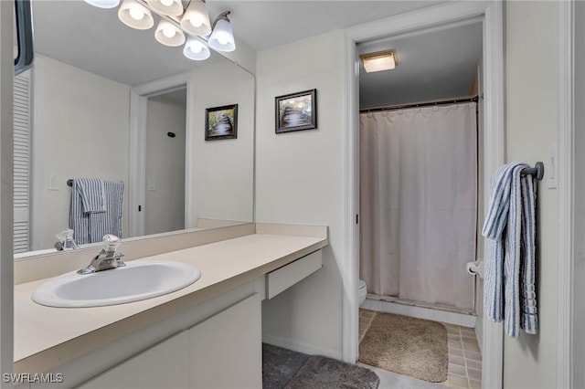 bathroom featuring a shower with shower curtain, vanity, and toilet