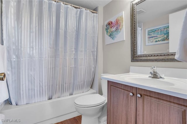 full bathroom featuring shower / tub combo, vanity, hardwood / wood-style flooring, and toilet