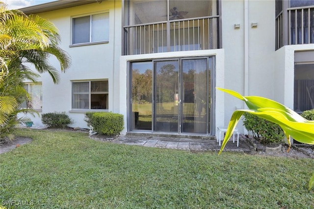 property entrance featuring a yard