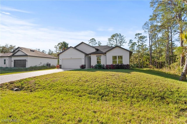 view of front of home featuring a garage and a front yard