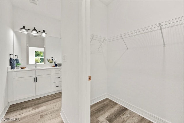 interior space with light wood-type flooring and sink