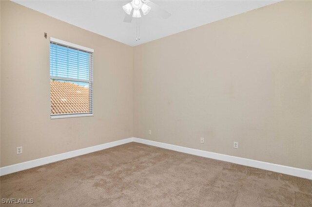 carpeted empty room with ceiling fan