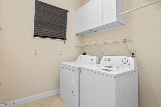 laundry area featuring cabinets and independent washer and dryer