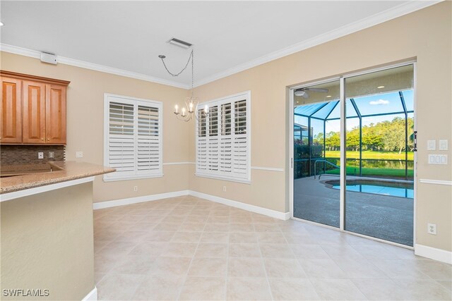 unfurnished dining area featuring light tile patterned floors, an inviting chandelier, and crown molding