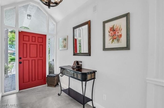 entryway featuring a healthy amount of sunlight and vaulted ceiling