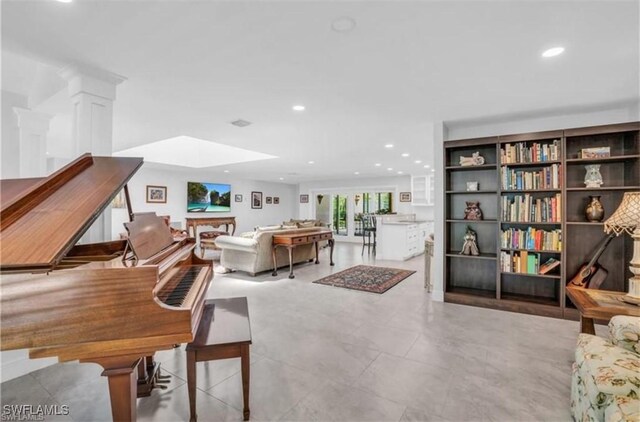 living room featuring a skylight