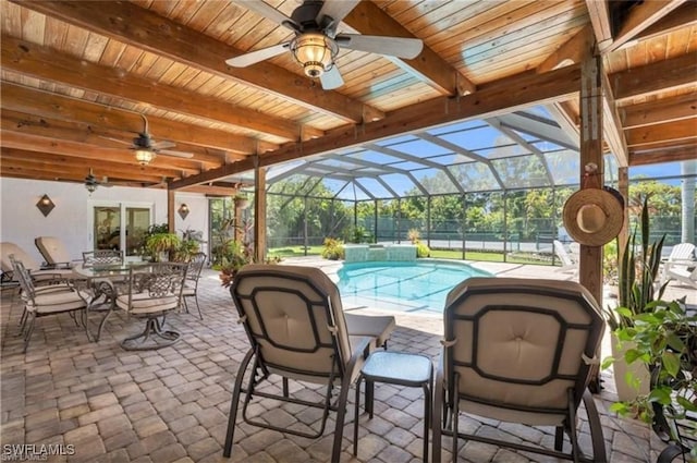 view of patio / terrace featuring a lanai and ceiling fan