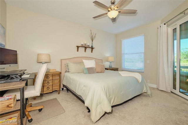 bedroom with access to outside, ceiling fan, and light colored carpet