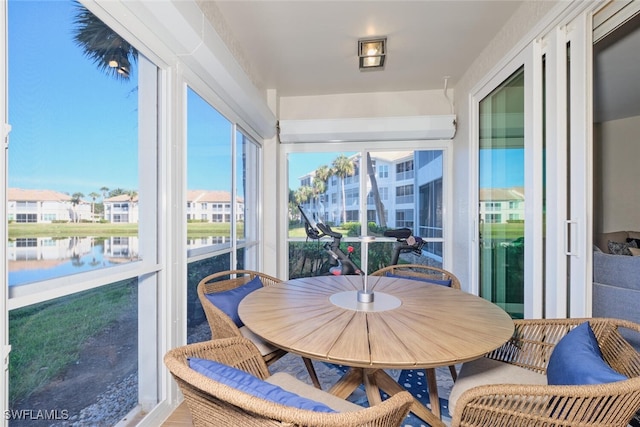 sunroom with a water view