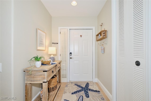 doorway to outside featuring light tile patterned floors