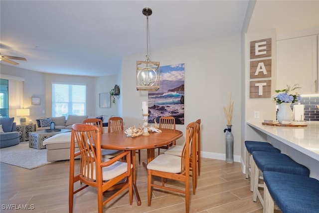 dining area featuring light hardwood / wood-style floors and ceiling fan