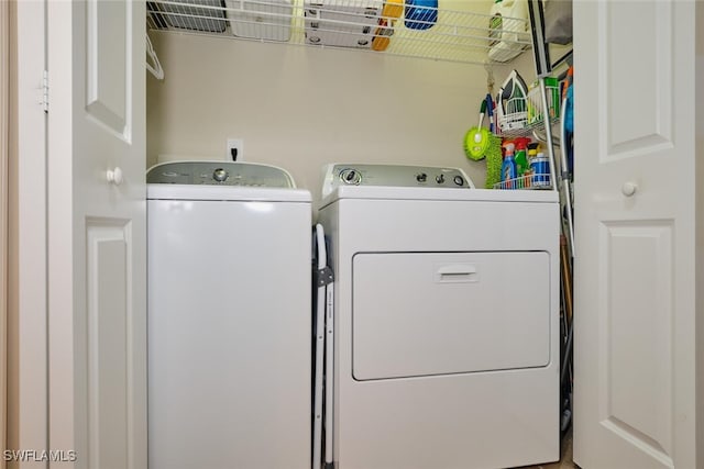 laundry room featuring washing machine and dryer