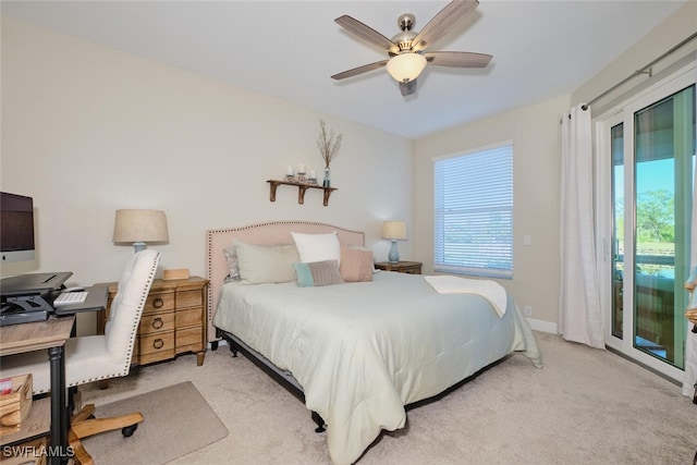 carpeted bedroom with ceiling fan and access to exterior