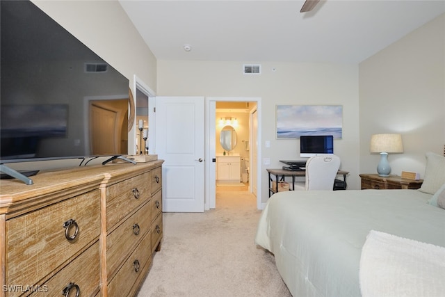 carpeted bedroom with ceiling fan and connected bathroom