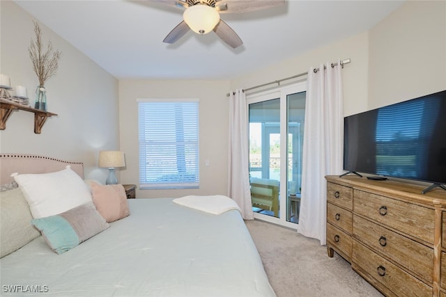 carpeted bedroom featuring access to outside and ceiling fan