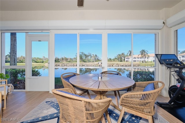 sunroom with a water view