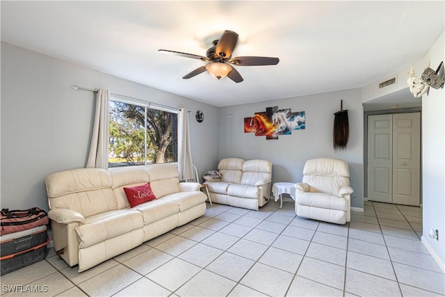 living room with ceiling fan and light tile patterned floors