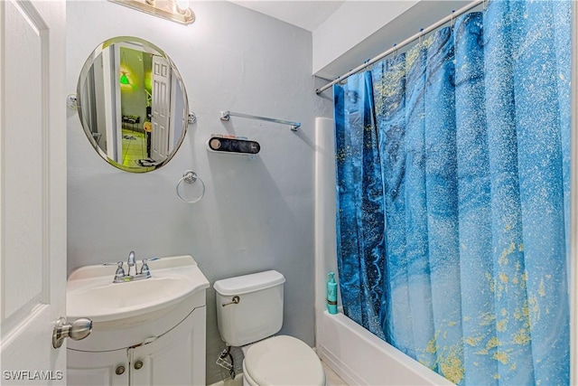 full bathroom featuring vanity, toilet, and shower / tub combo with curtain