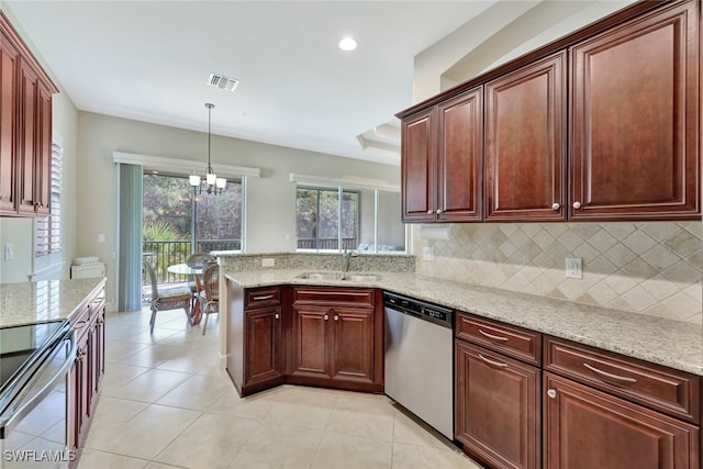 kitchen featuring an inviting chandelier, sink, appliances with stainless steel finishes, decorative light fixtures, and light stone counters