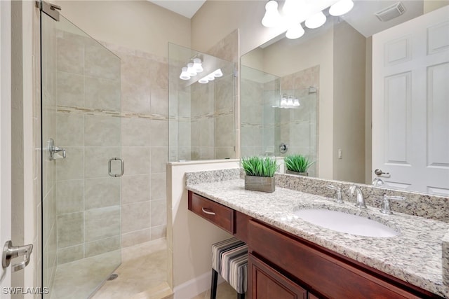 bathroom featuring vanity and walk in shower