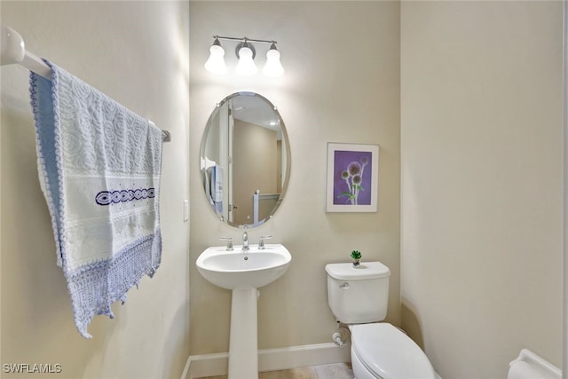 bathroom with sink and toilet