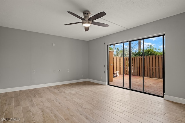 spare room featuring ceiling fan and light wood-type flooring