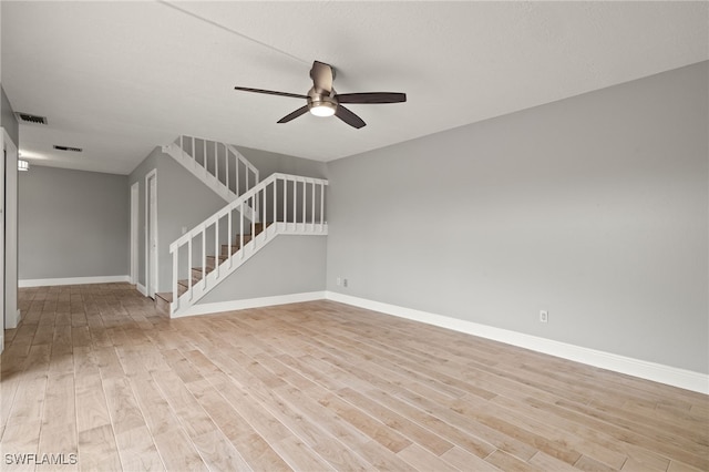 unfurnished room with light hardwood / wood-style flooring and ceiling fan