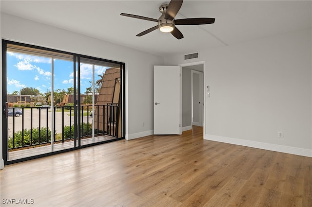 spare room with ceiling fan and light hardwood / wood-style flooring