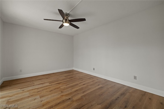 unfurnished room with ceiling fan and light hardwood / wood-style flooring