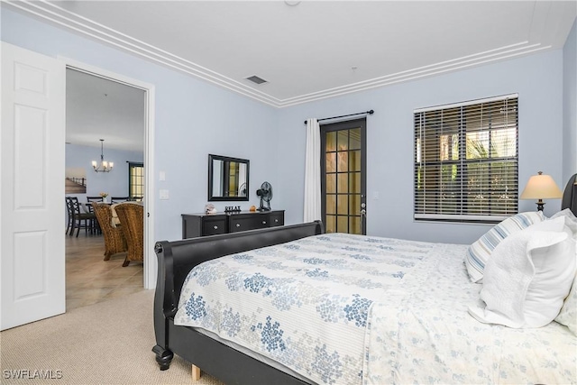 bedroom featuring light carpet and a notable chandelier