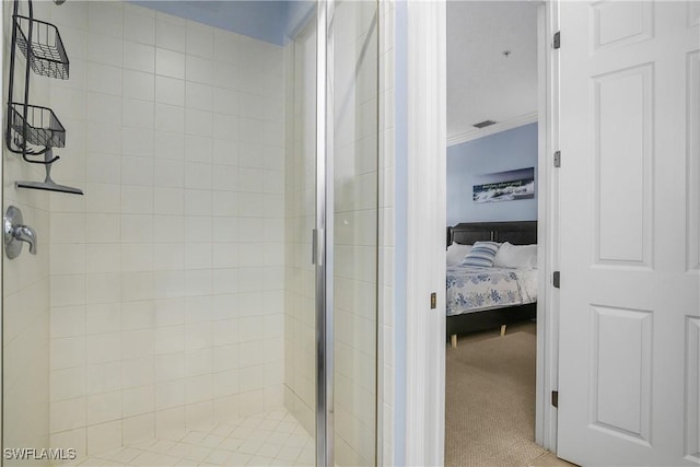 bathroom featuring crown molding and walk in shower