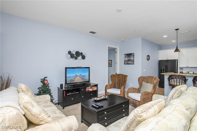 living room with light tile patterned floors